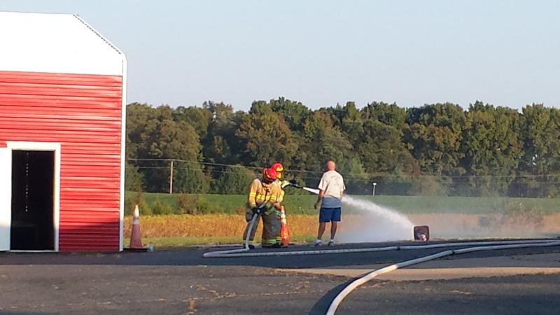 Chief W. Seablom working with the new members on hoseline deployment and firestreams. 