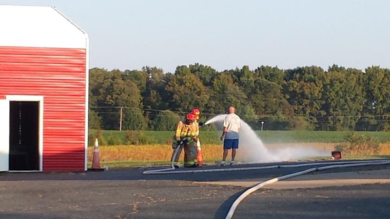 Chief W. Seablom working with the new members on hoseline deployment and firestreams. 